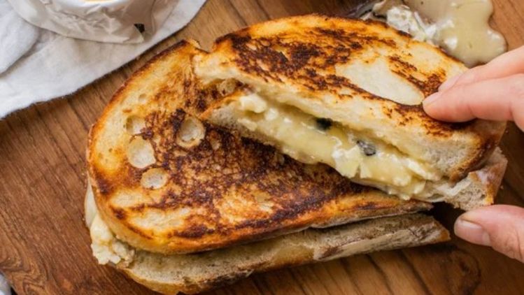 Truffle grilled cheese with Mt Tam triple cream cheese, toasted until golden and filled with rich, melty cheese and earthy black truffles.