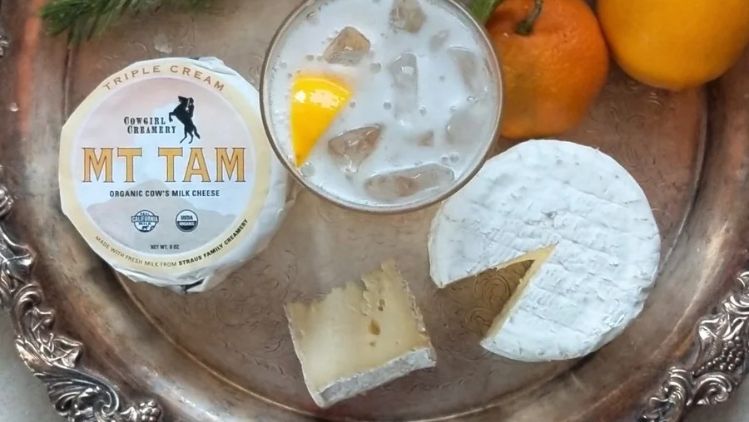 Rosemary honey shrub served with Mt Tam triple cream cheese, creating an elegant pairing of creamy, citrusy, and herbaceous flavors.