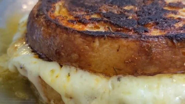 Bloody Mary grilled cheese sandwich with melted artisan cheese on toasted bread, grilled until golden brown and irresistibly crisp.