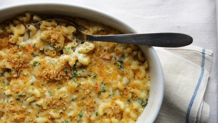 Classic baked mac and cheese made with sharp cheddar and artisan cheeses, featuring a creamy sauce and a golden, crispy breadcrumb topping.