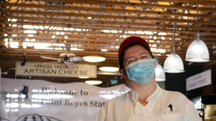 Hilary, manager of the Pt Reyes Creamery Barn Shop &amp; Cantina, welcomes visitors to explore artisan cheeses and local culinary specialties.