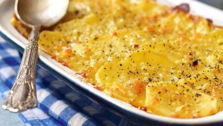 Red Hawk potato gratin baked until golden and bubbling, featuring layers of tender potatoes and rich, creamy artisan cheese.
