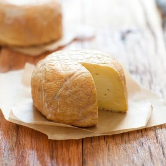 Red Hawk artisan cheese with a creamy, buttery interior and distinctive washed rind, handcrafted to deliver rich flavor and exceptional depth.