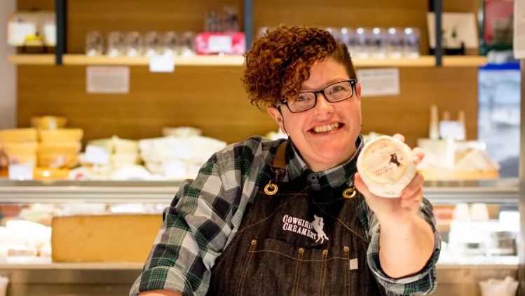 Cowgirl Creamery’s Mt Tam triple cream cheese presented by a retail expert, highlighting the rich texture and artisanal craftsmanship behind the creamery’s flagship cheese.